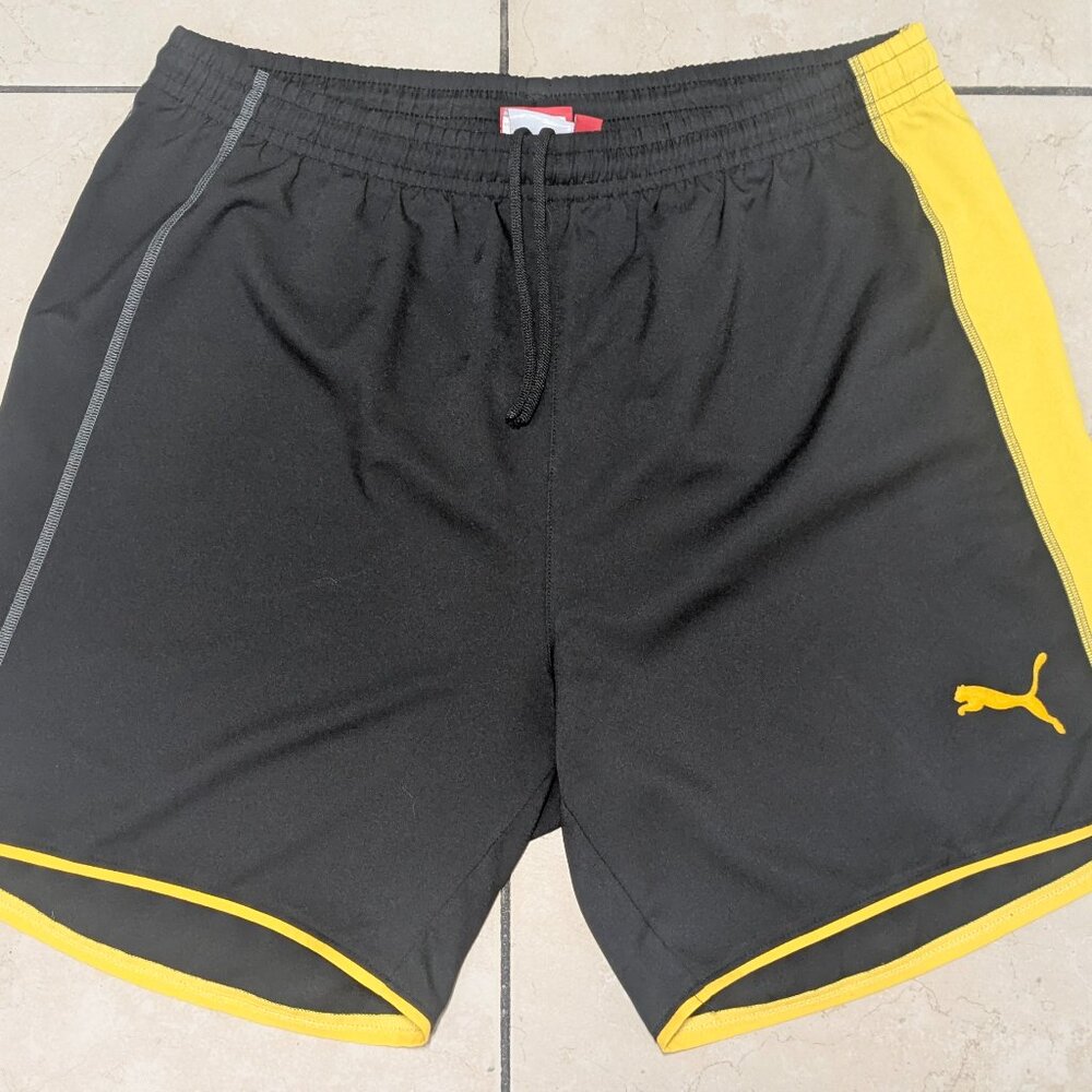 Puma Soccer Shorts Men's Size XL in black and yellow color.